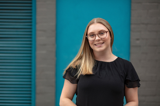 Headshot of team member smiling